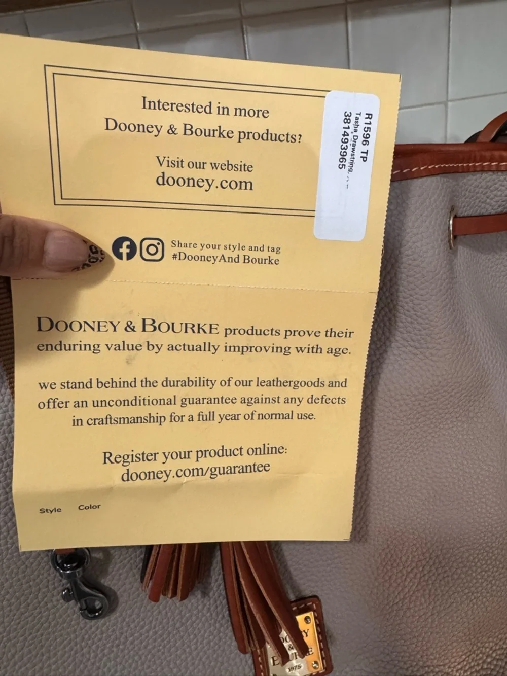Dooney & Bourke Taupe Pebbled Leather Drawstring Bucket Bag with Brown Trim - Picture 3 of 5